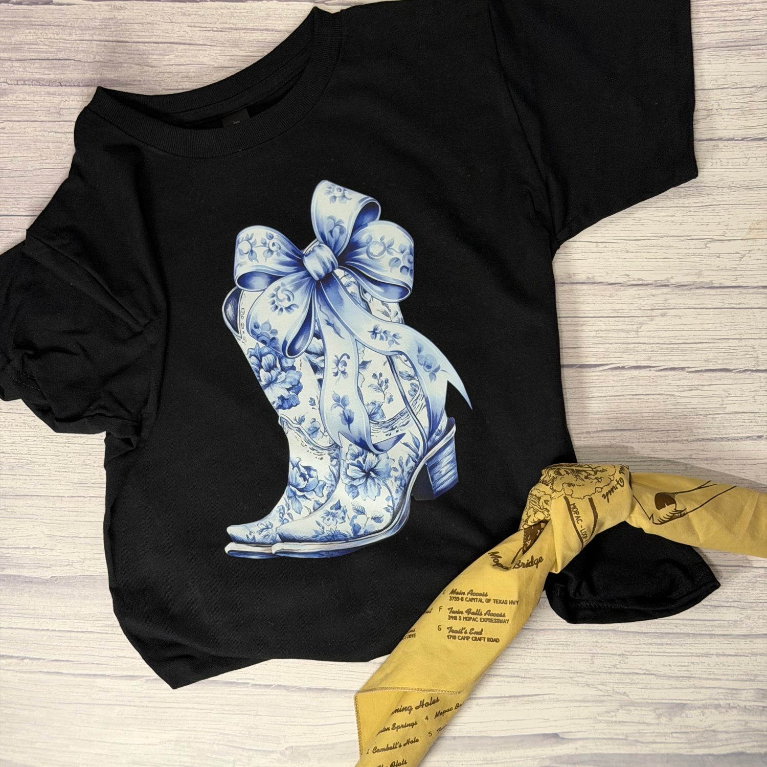 Blue and white floral boots with a large bow